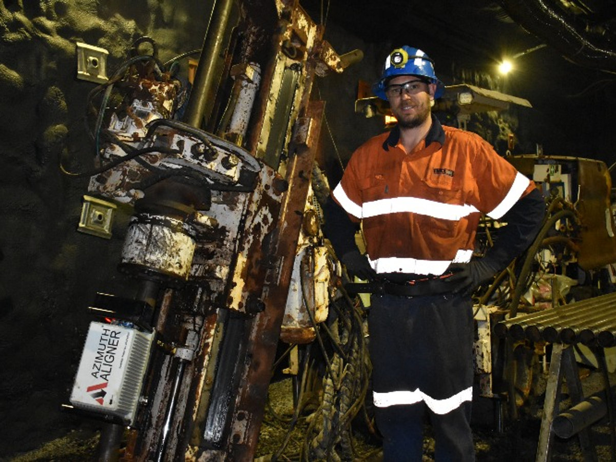 Drill rig being aligned with an azimuth aligner